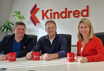 Grant Shapps, Simon Wrenn and Lucy Waller sitting in front of Kindred logo